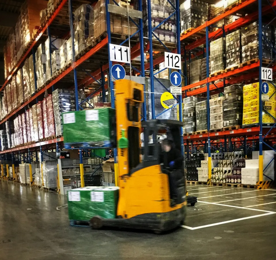 Palletized freight being handled in a warehouse